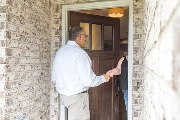 inspector meets homeowner at front door for walk and talk inspection