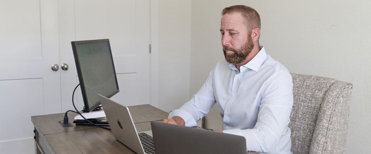 richard hood working on inspection report at office-min richard hood working on inspection report at office